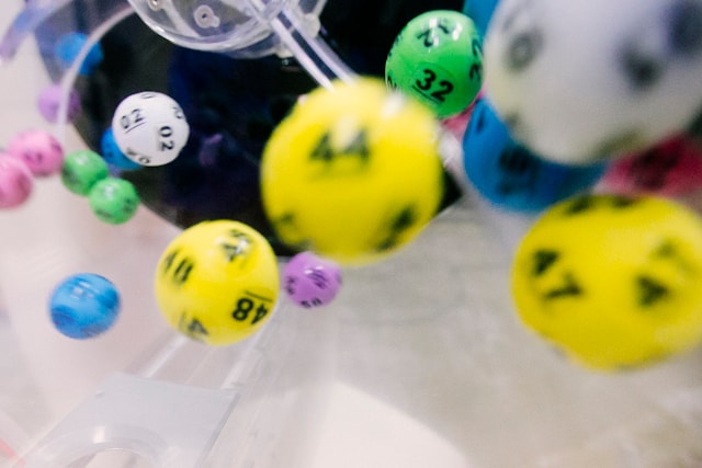 A photo of lottery balls been dropped to determine the chosen number.