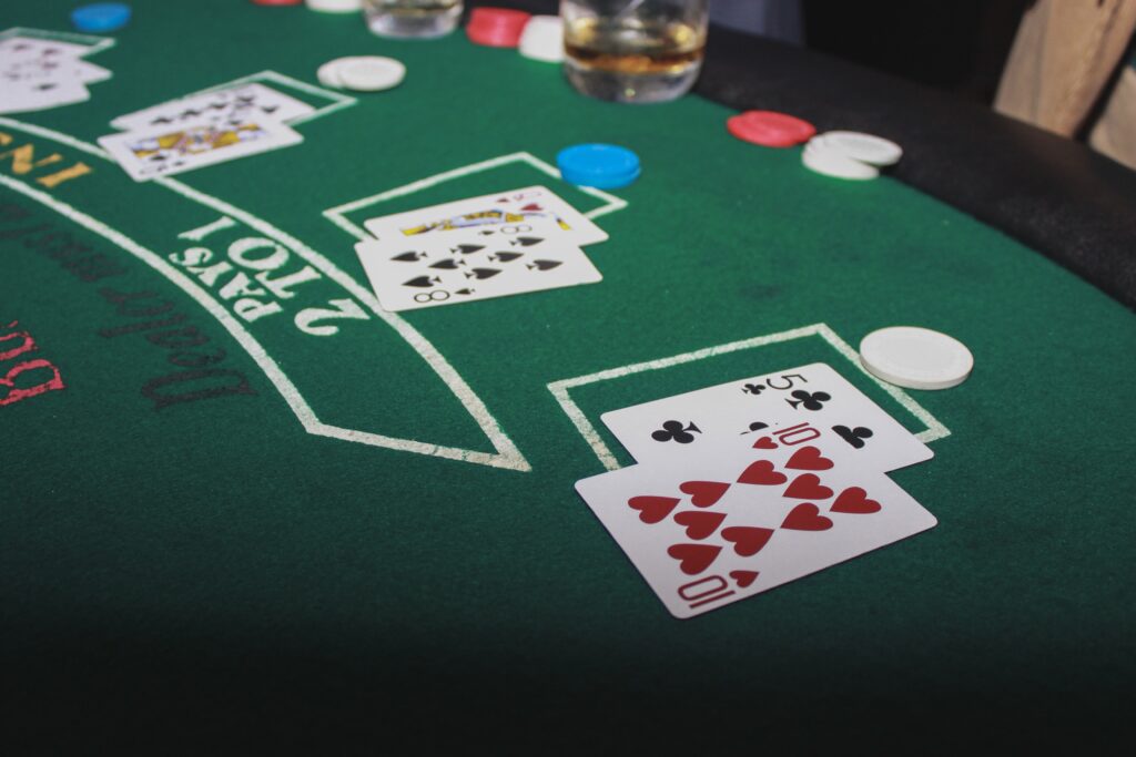 A photo of cards on a blackjack table.