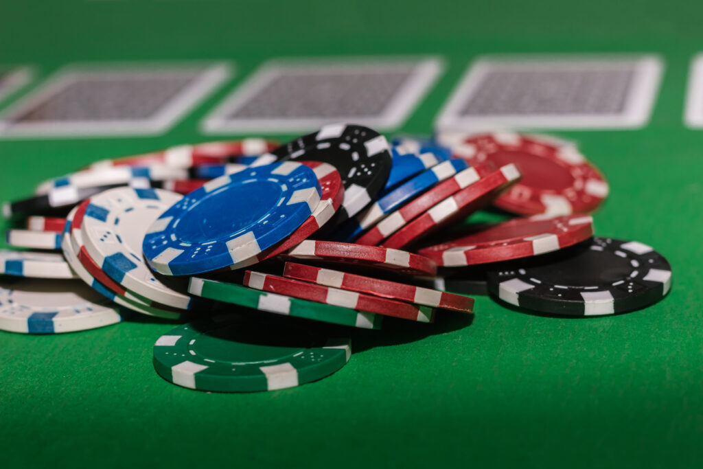 A photo of casino chips on a poker table.