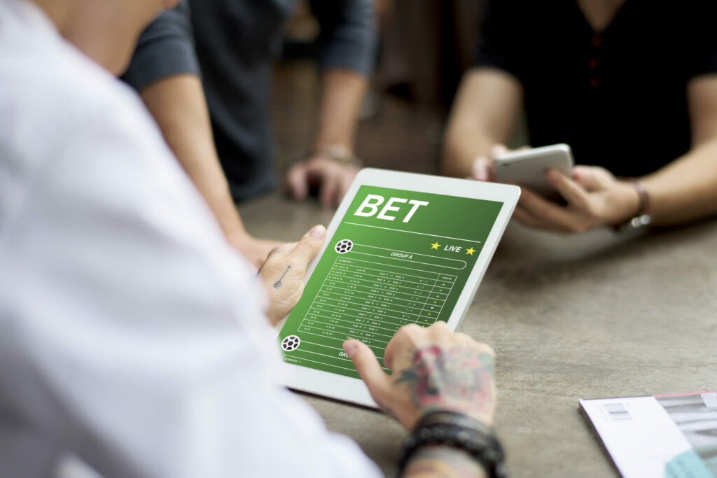 A photo of a person using a betting app.