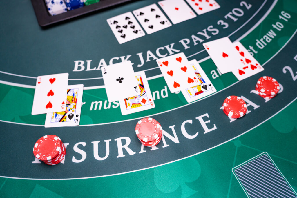 A photo of multiple blackjack hands on a blackjack table.