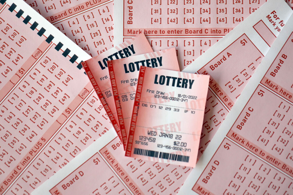 A close up photo of three lottery tickets.