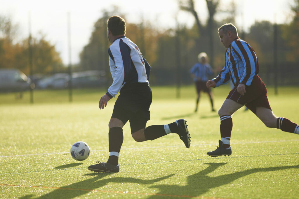 A photo of two football players during a match.
