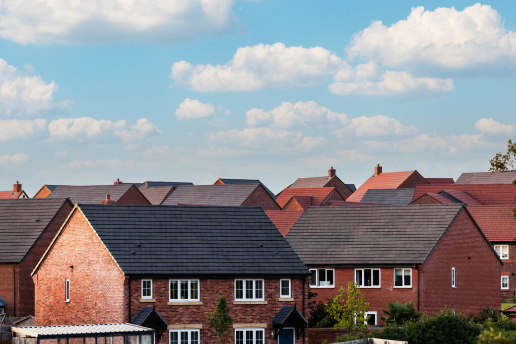 Houses in England with typical red bricks on a sunny day.