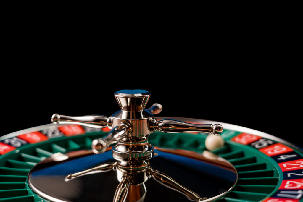 Close up of a roulette wheel on an isolated on black background.