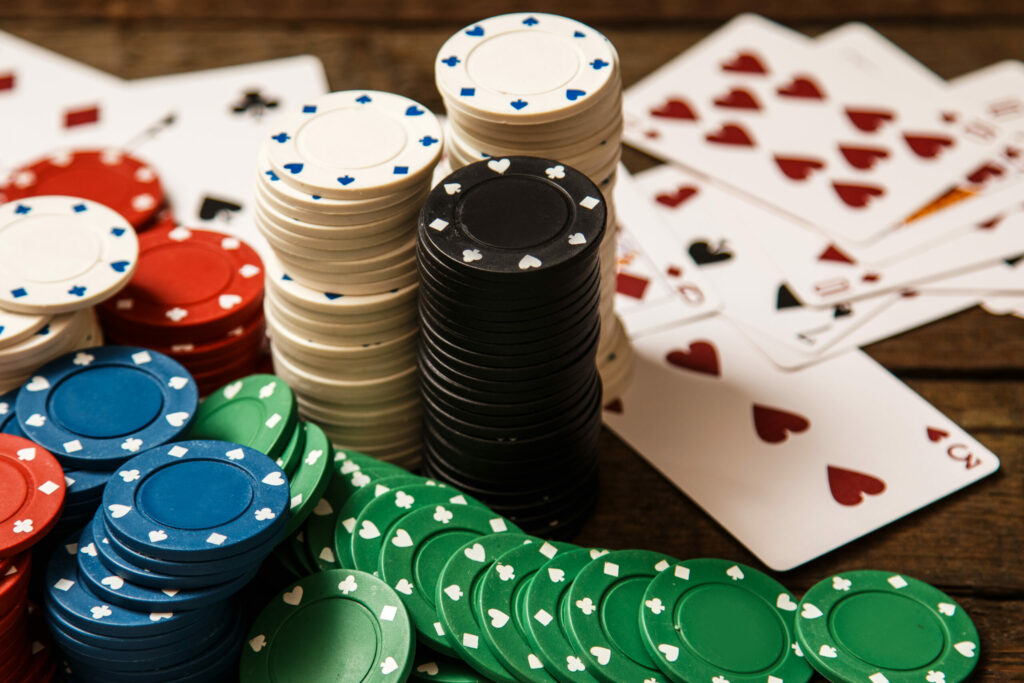 Stacks of casino chips and playing cards.