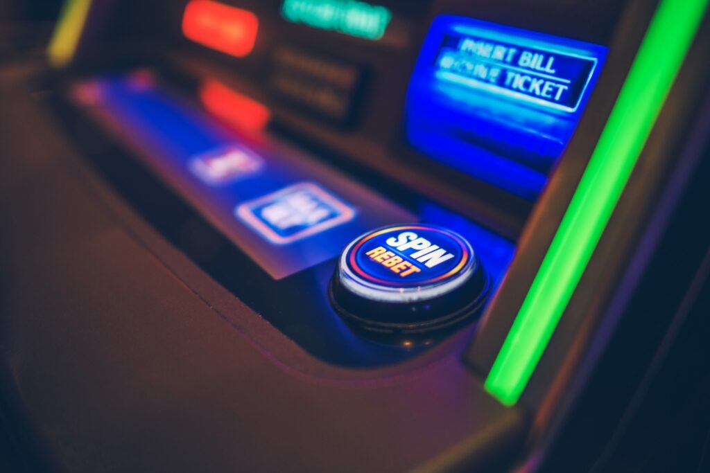 Close up of a button on a slot machine.