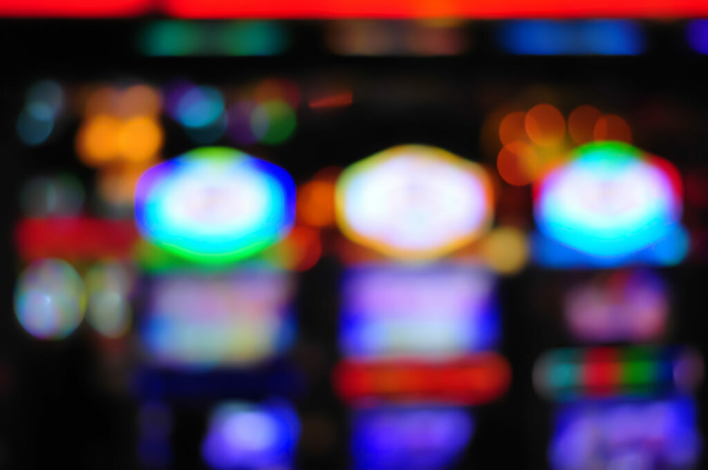 Slot machines in a casino. Image blurred.